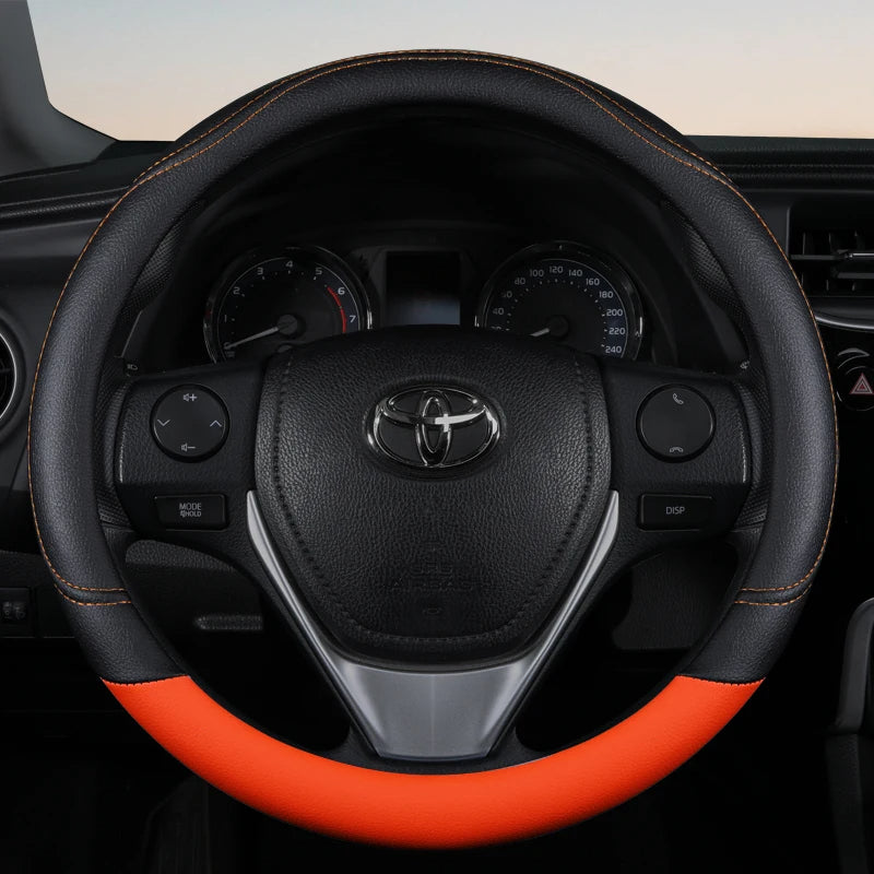 Capa laranja estilosa para volante com couro firme e elegante.