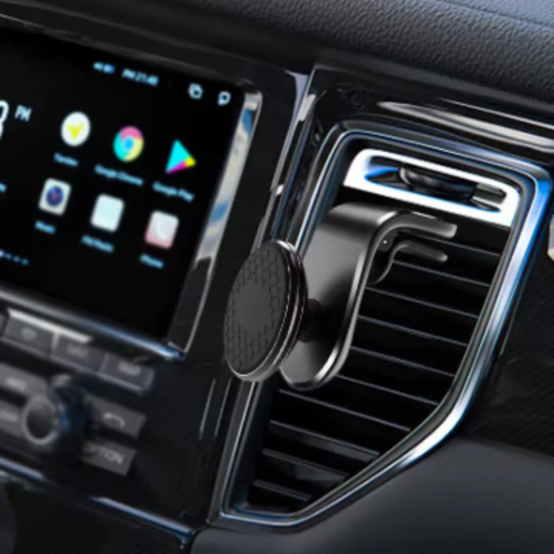 Imagem mostra suporte magnético fixado somente na ventilação do carro, uso direcionado.